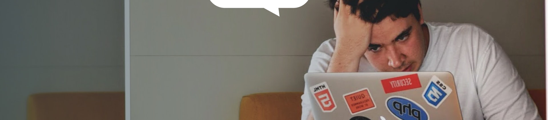 An image of a frustrated student looking at a screen.