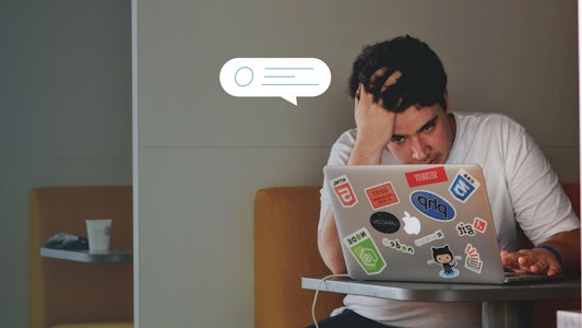 An image of a frustrated student looking at a screen.