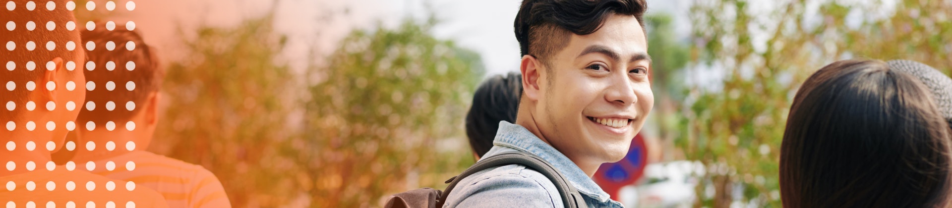 Student turning around and smiling at the camera.