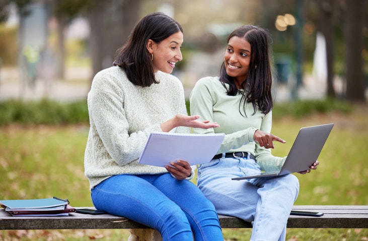Shot of two young women studying together at college stock photo
