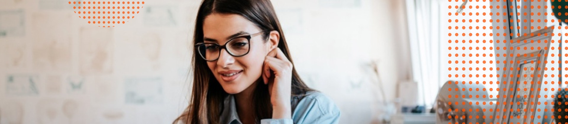 Female student sits at a laptop.
