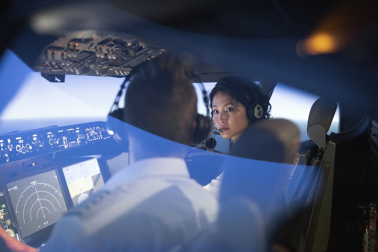Two pilots flying in a plane in flight school