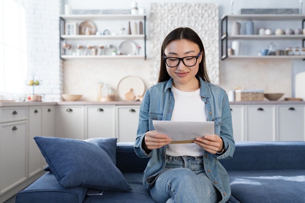 Young Asian female receiving good news