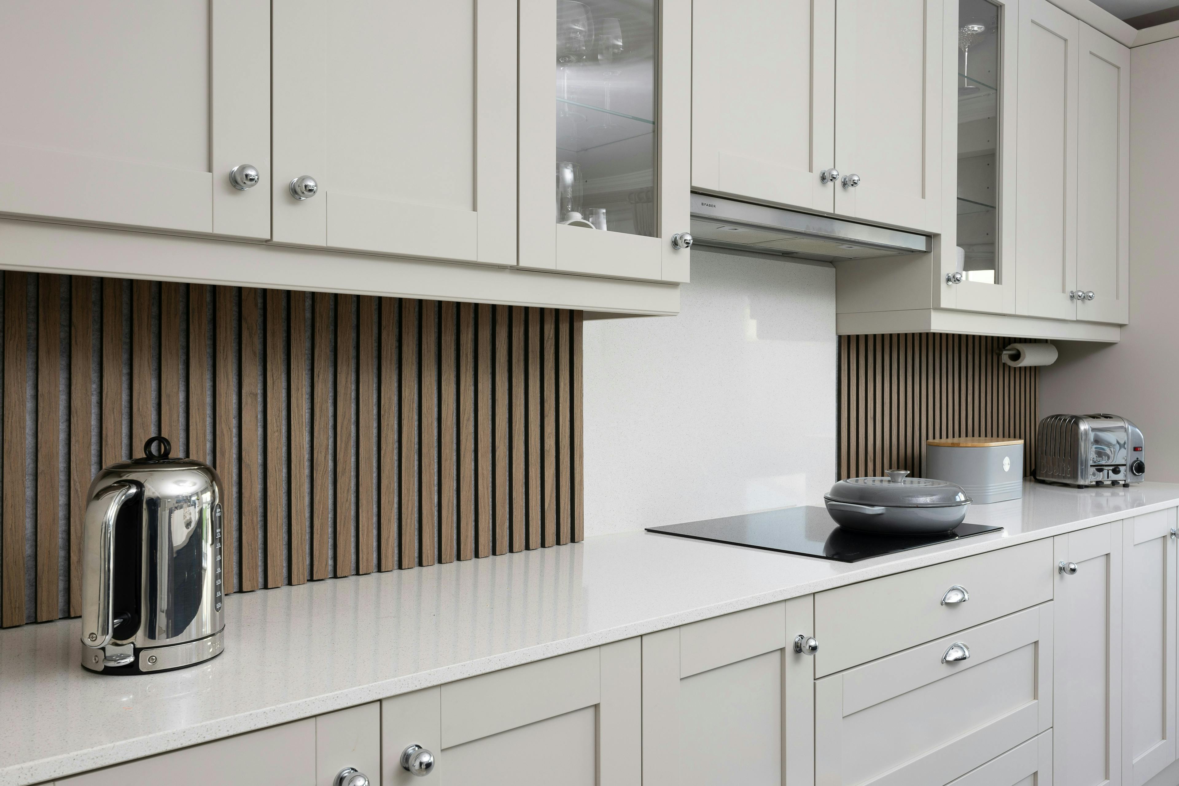 Gray kitchen with a pan on the hob 