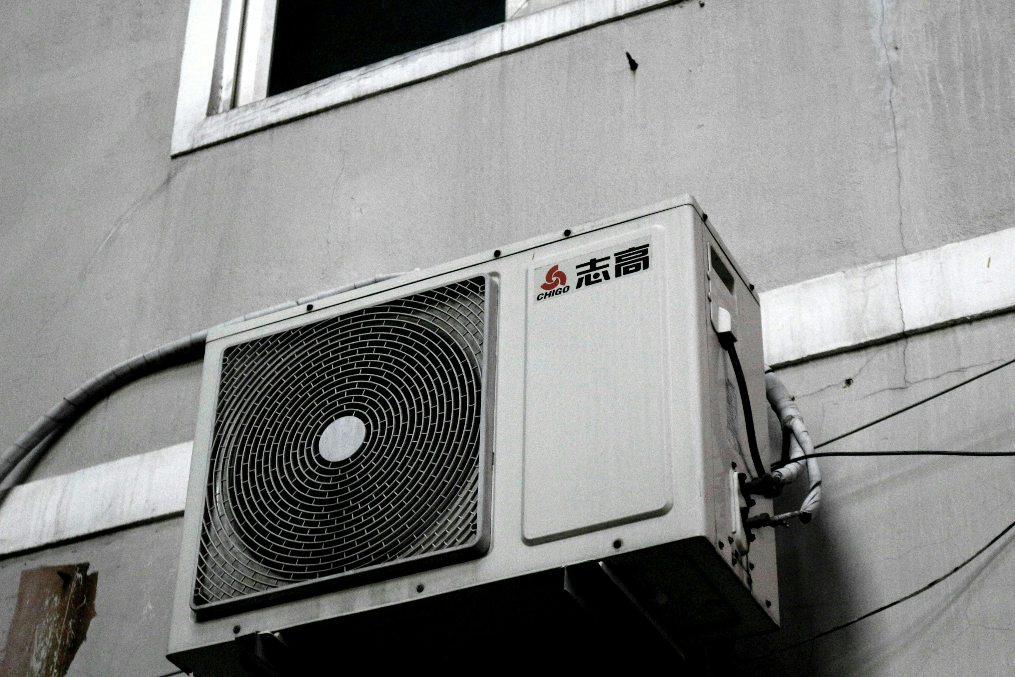 Air Source Heat Pump on a grey wall