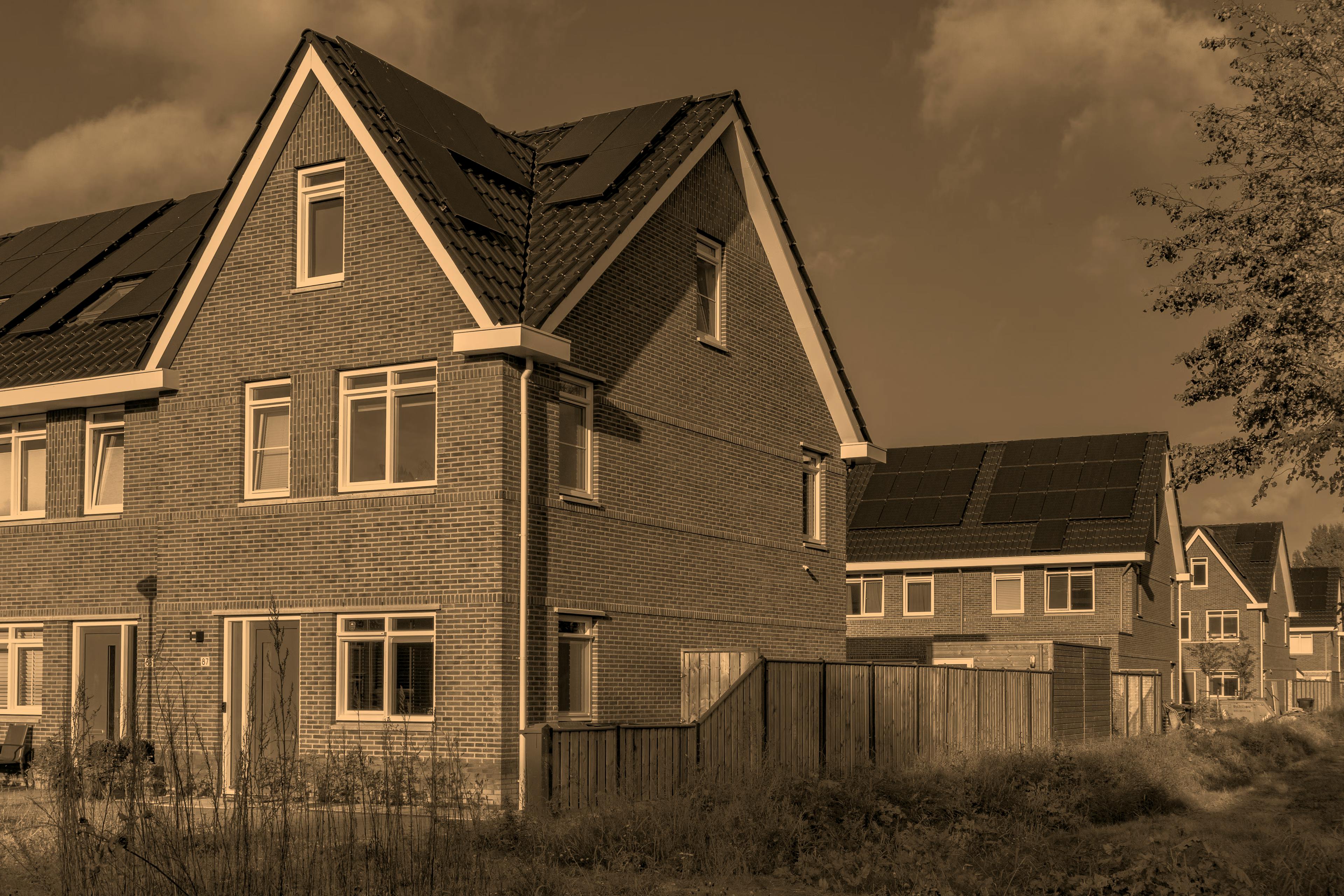 Houses with solar panels on the roofs