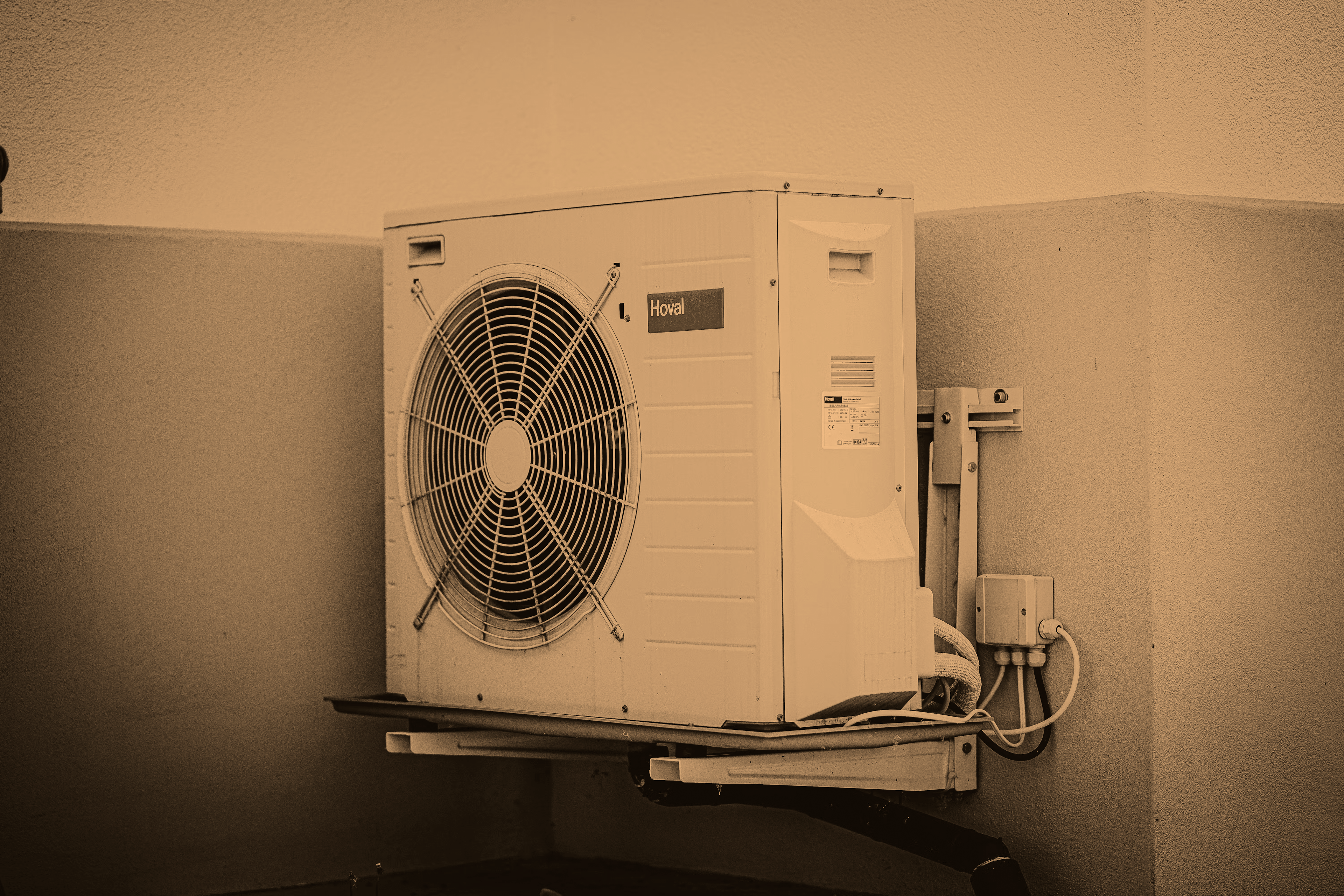 Air source heat pump on a wall