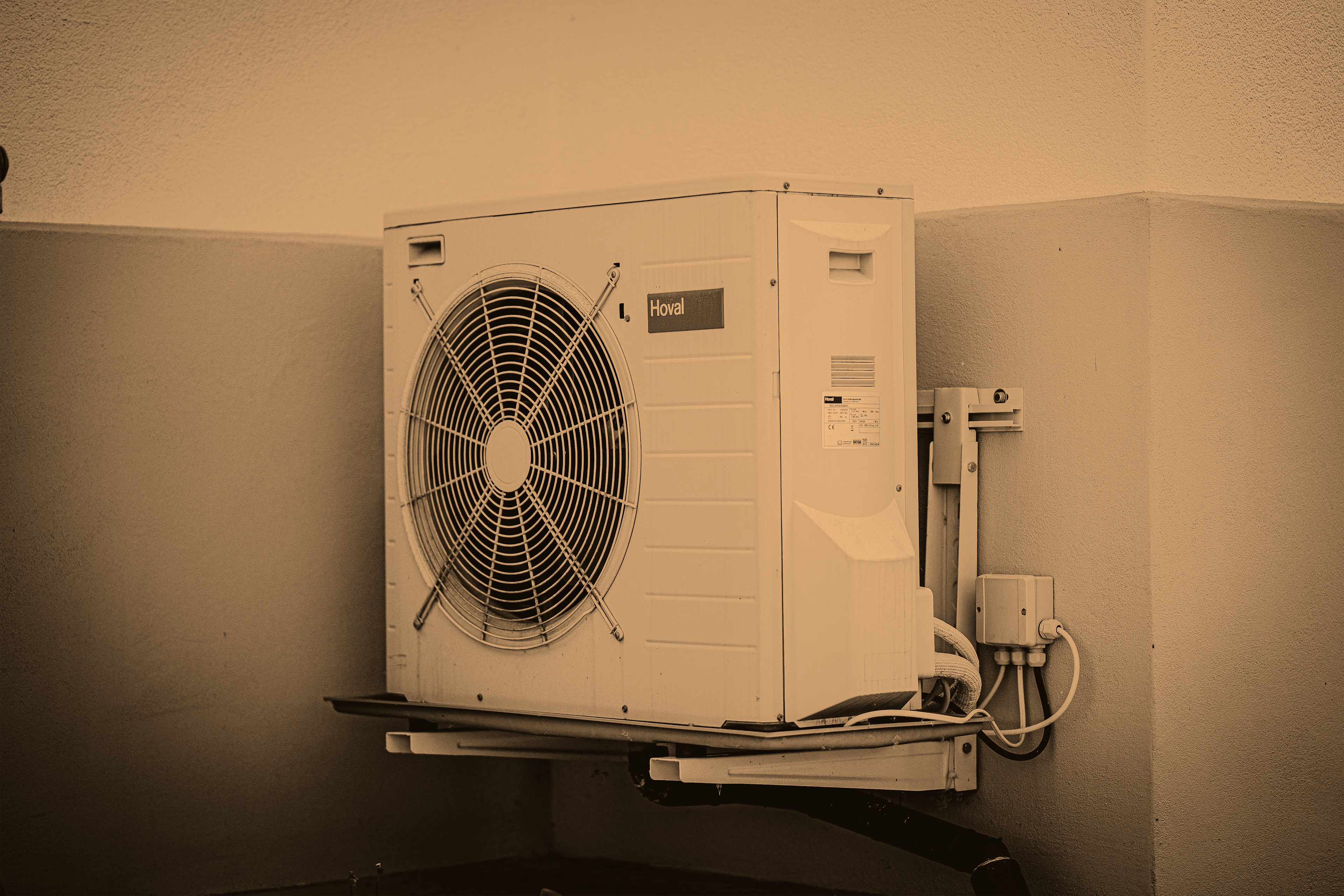 Air source heat pump on a wall

