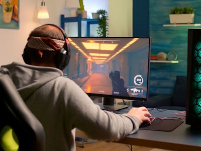 https://images.prismic.io/elevenrush/8bf87960-5c5f-493a-a29c-2d97aeb94501_addicted-video-game-r-performing-cyber-video-games-using-professional-headphones-gaming-room-competitive-gamer-playing-video-game-tournament-with-new-graphics-powerful-computer.jpg?auto=compress,format&rect=482,0,2880,2160&w=400&h=300