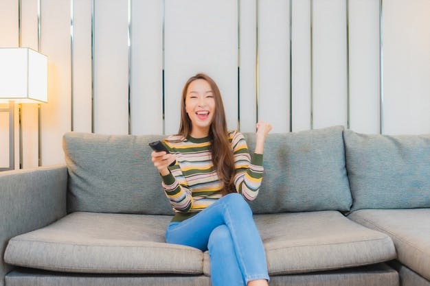 https://images.prismic.io/elevenrush/9a532729-2b58-4c21-b837-47bf3125cb60_portrait-beautiful-young-asian-woman-use-television-remote-sofa-living-room-interior_74190-13122.jpg?auto=compress,format