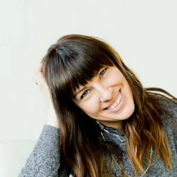 Photo by Adam Winger on Unsplash: https://unsplash.com/photos/woman-in-gray-long-sleeve-shirt-and-black-pants-sitting-on-white-couch-seBIOE8VvZs