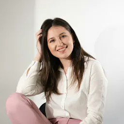 Photo by Ionela Mat on Unsplash: https://unsplash.com/photos/a-woman-sitting-on-a-chair-posing-for-a-picture-rp5tbm7vQ6c