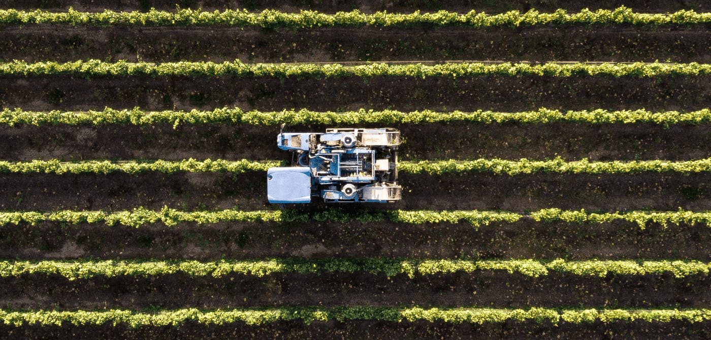 Drone image of tractor ploughing the field