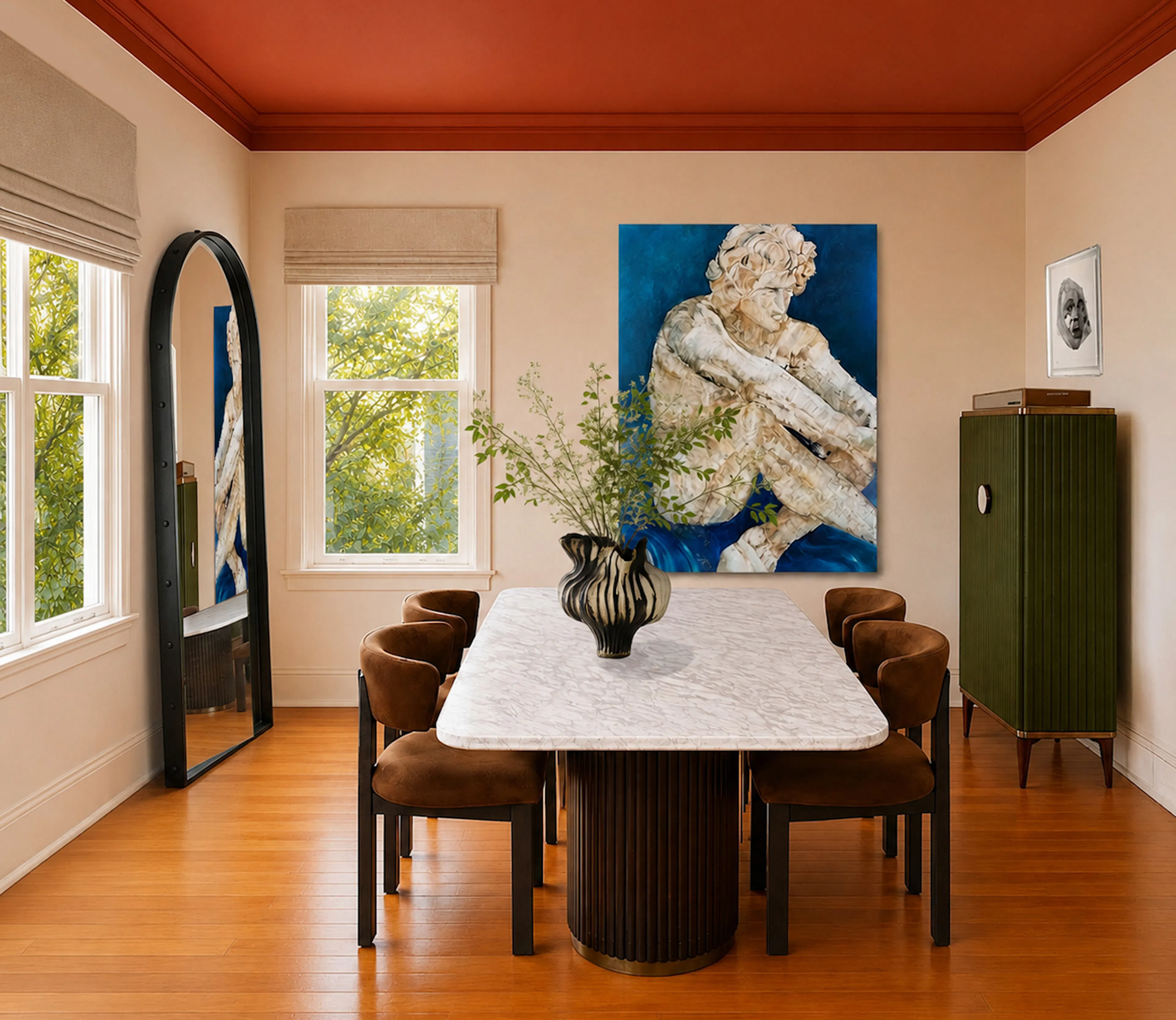 dining room with large marble table and a large blue painting of a greek sculpture. a green cabinet on the right and windows and a floor  tall leaning mirror in a black frame on the left.