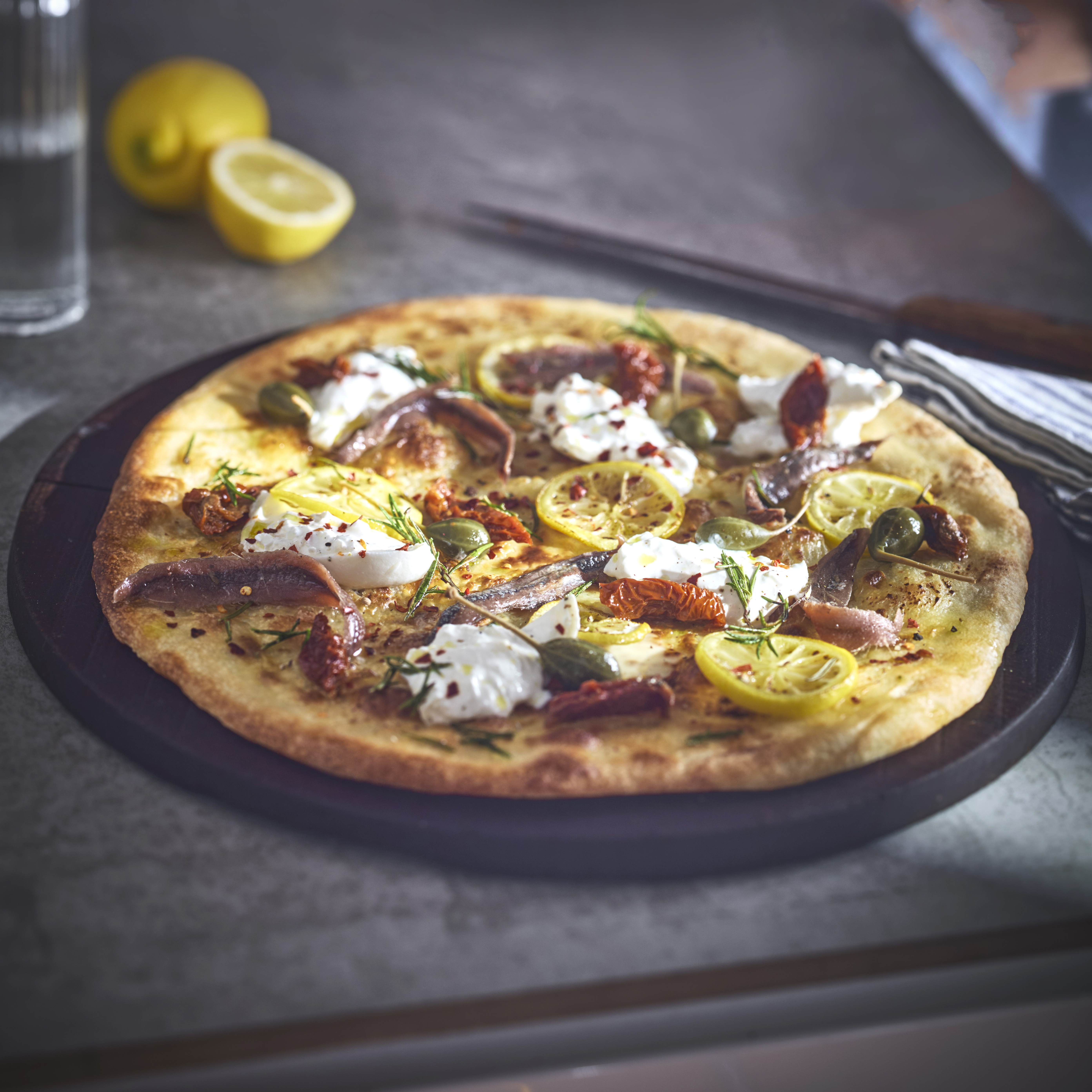 Lemon pizza, burrata, capers & anchovies