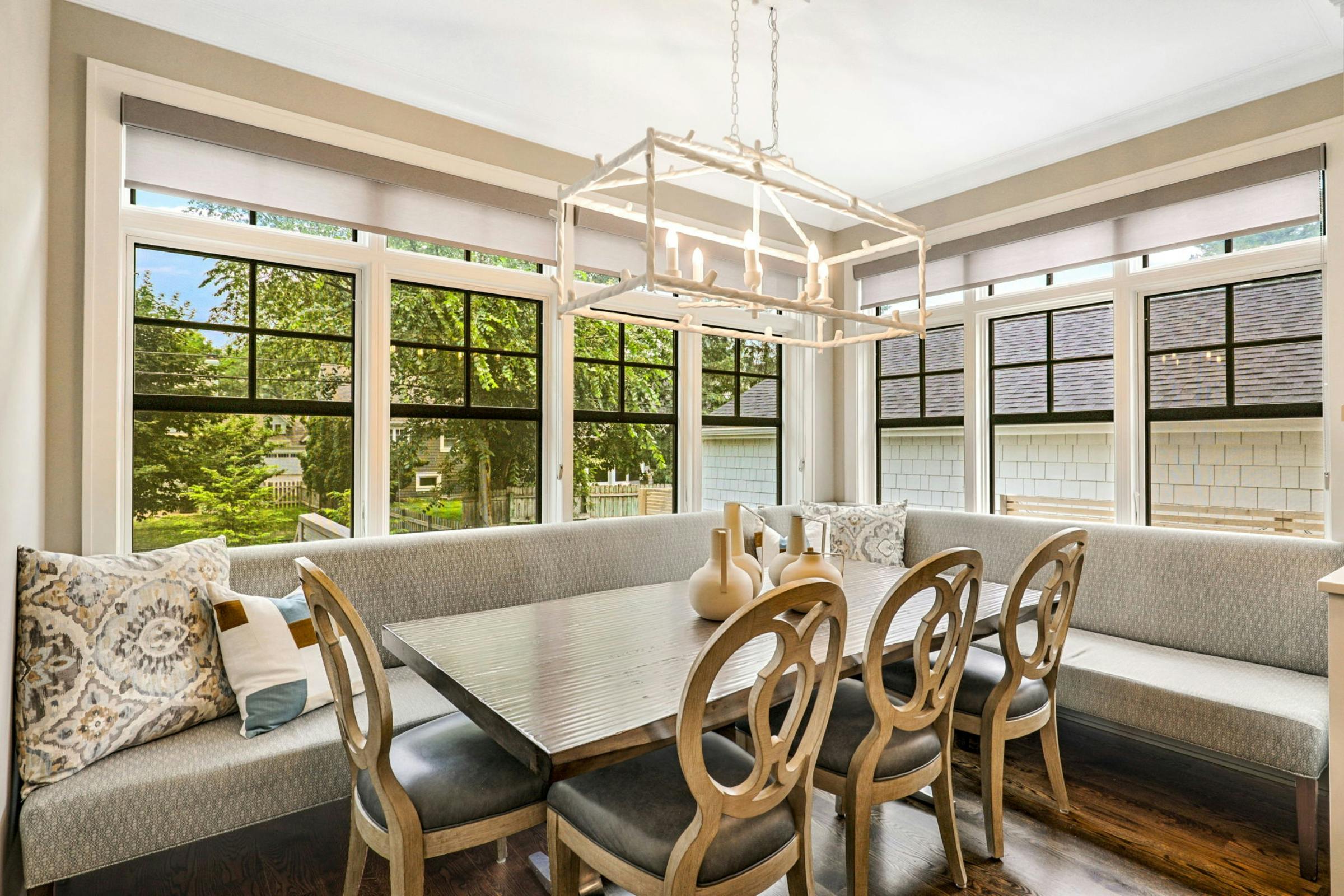 dining table and bench with white chandelier