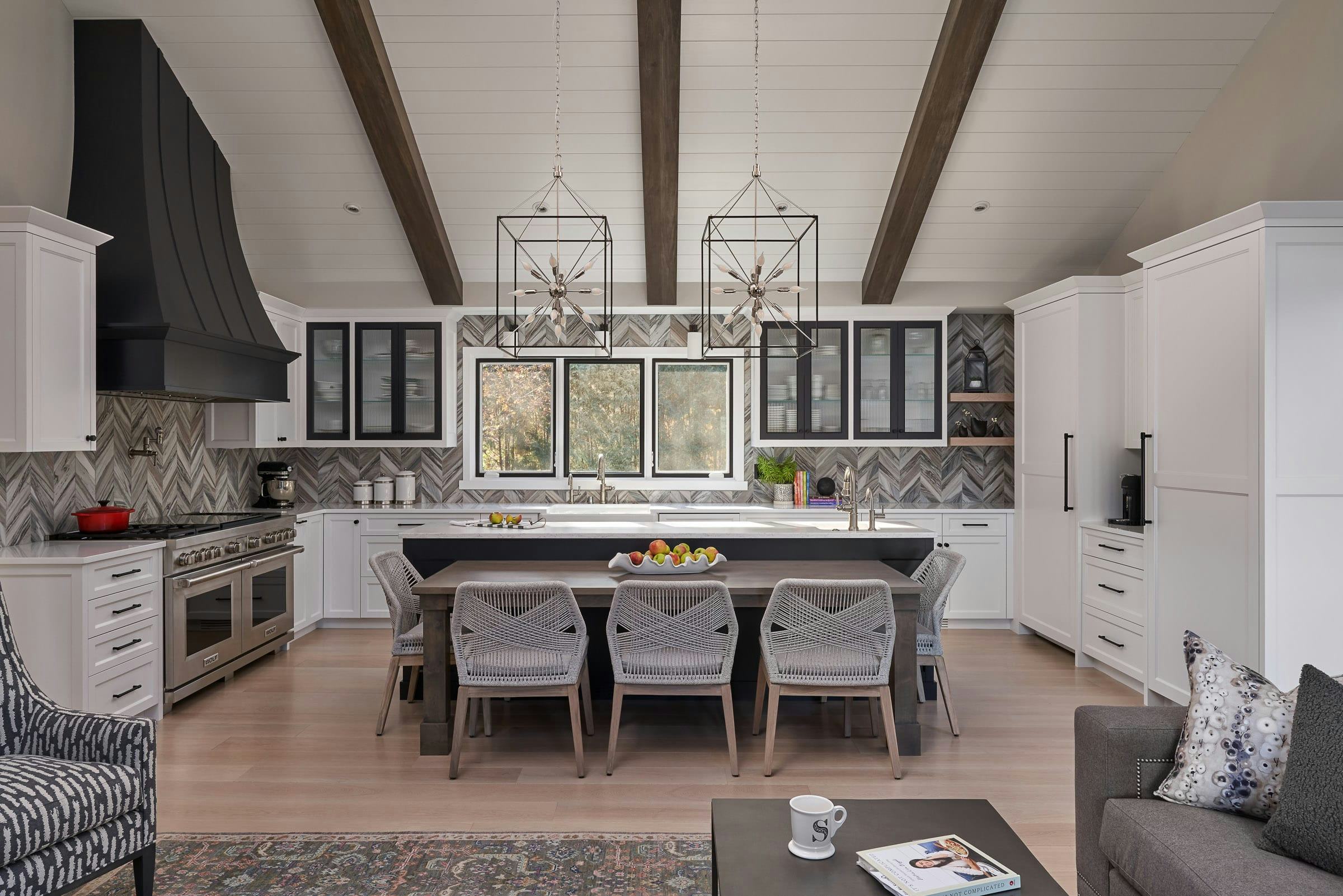 black and white kitchen with vaulted ceilings, kitchen table