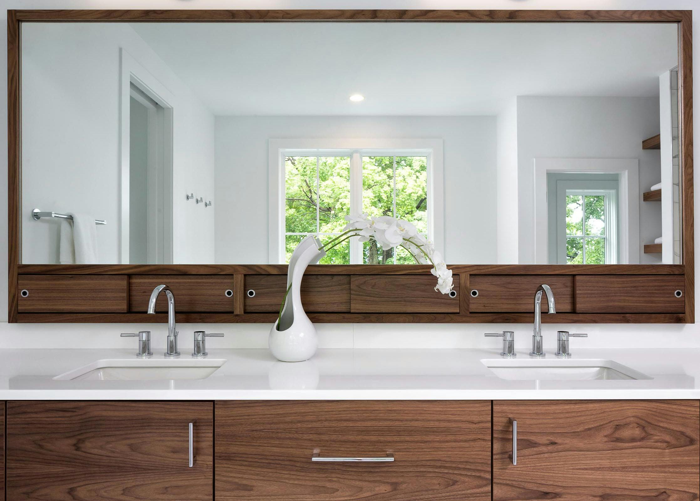 wood vanity with custom mirror and storage