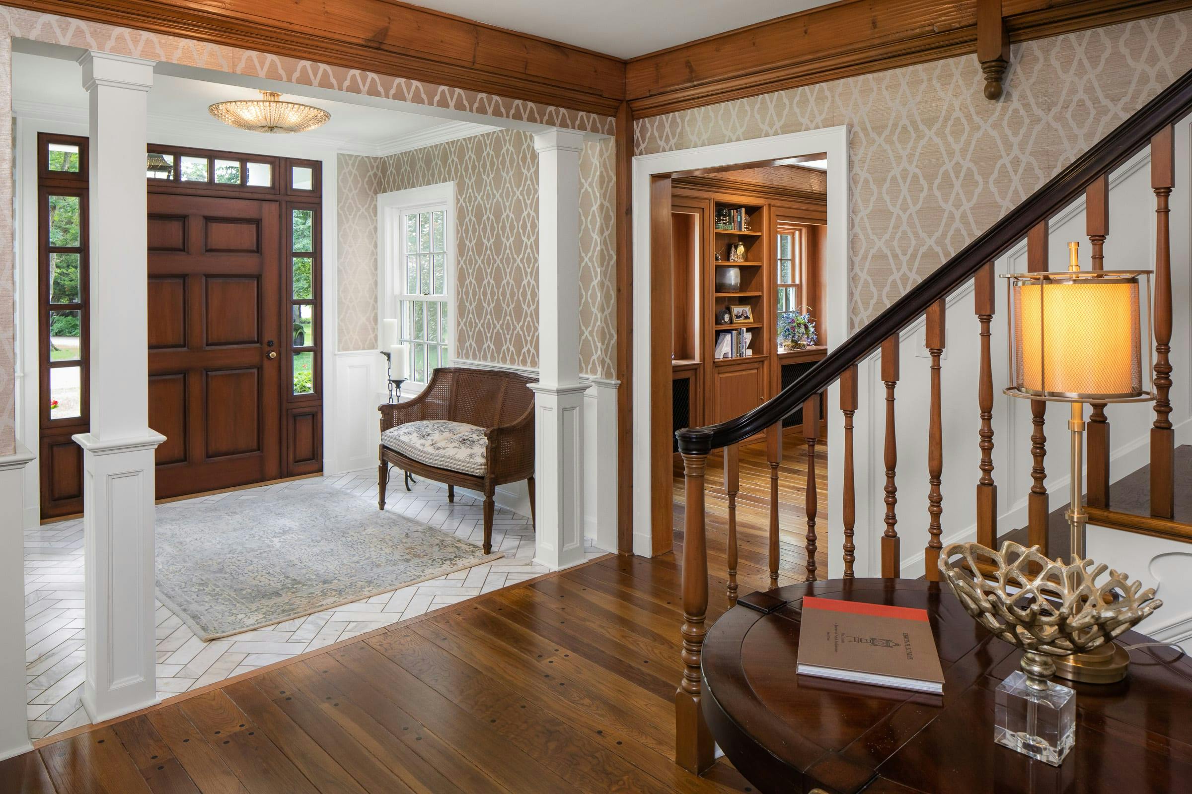 white marble vestibule, staircase, doorway to dining