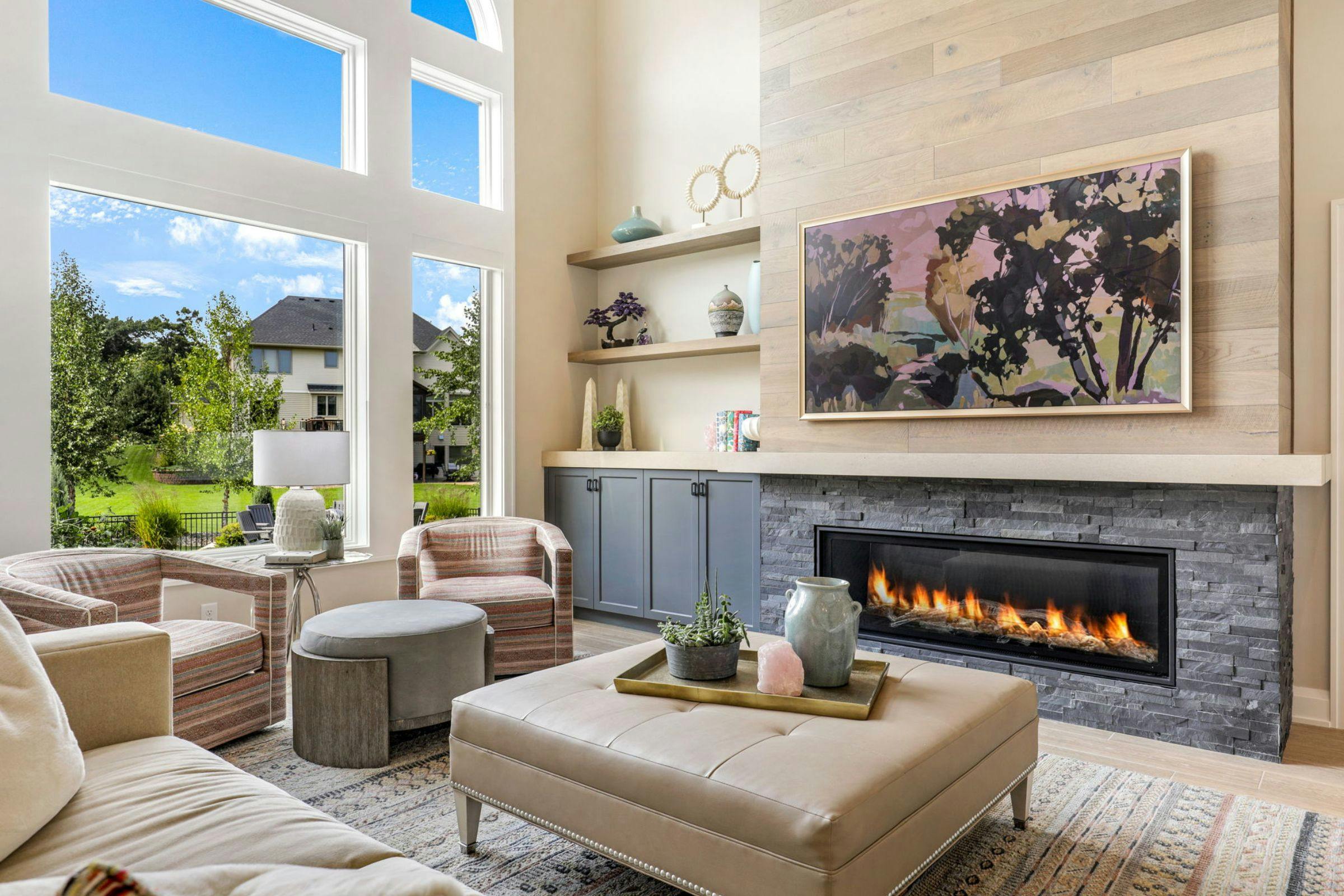 fireplace in family room with large windows