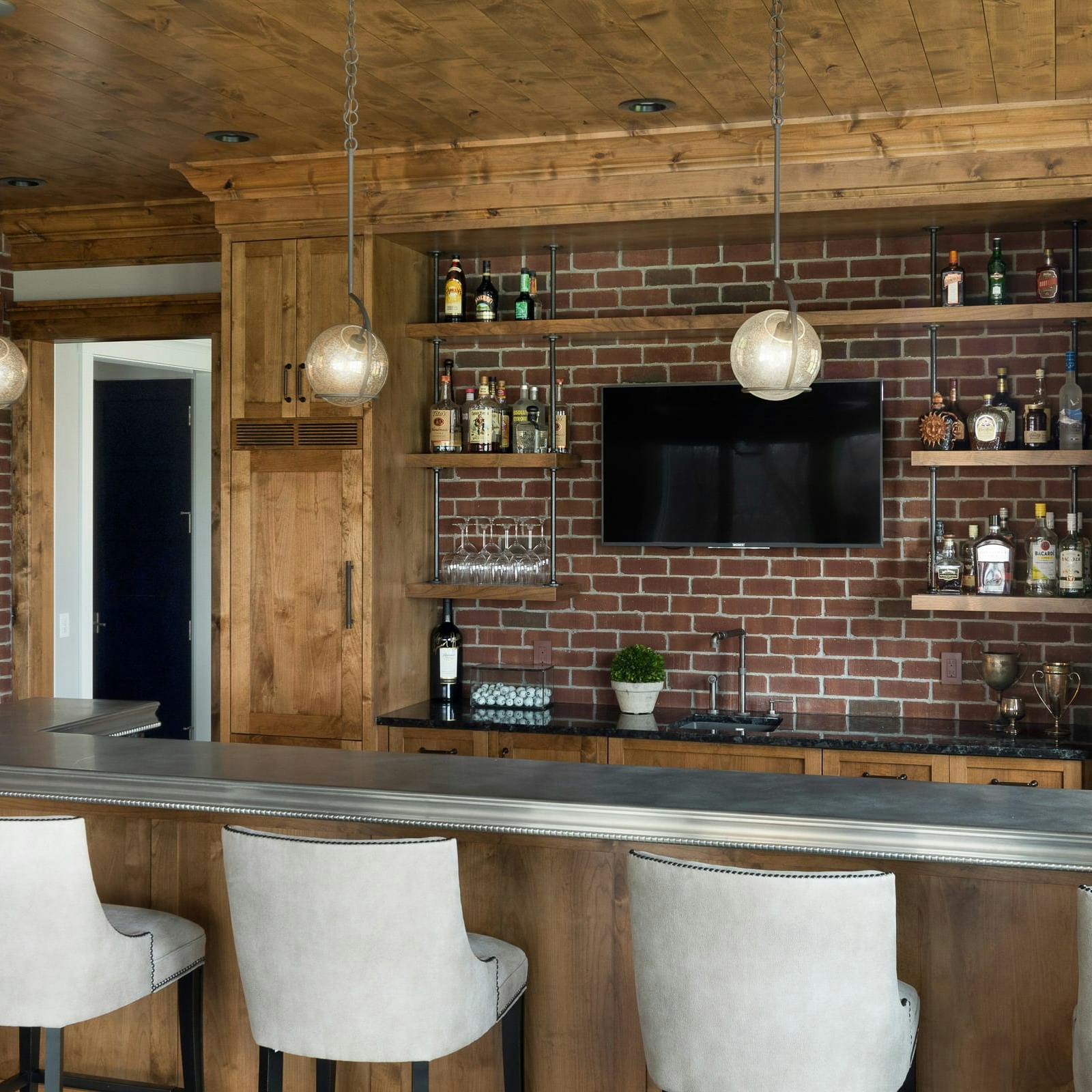 bar with TV and white bar stools