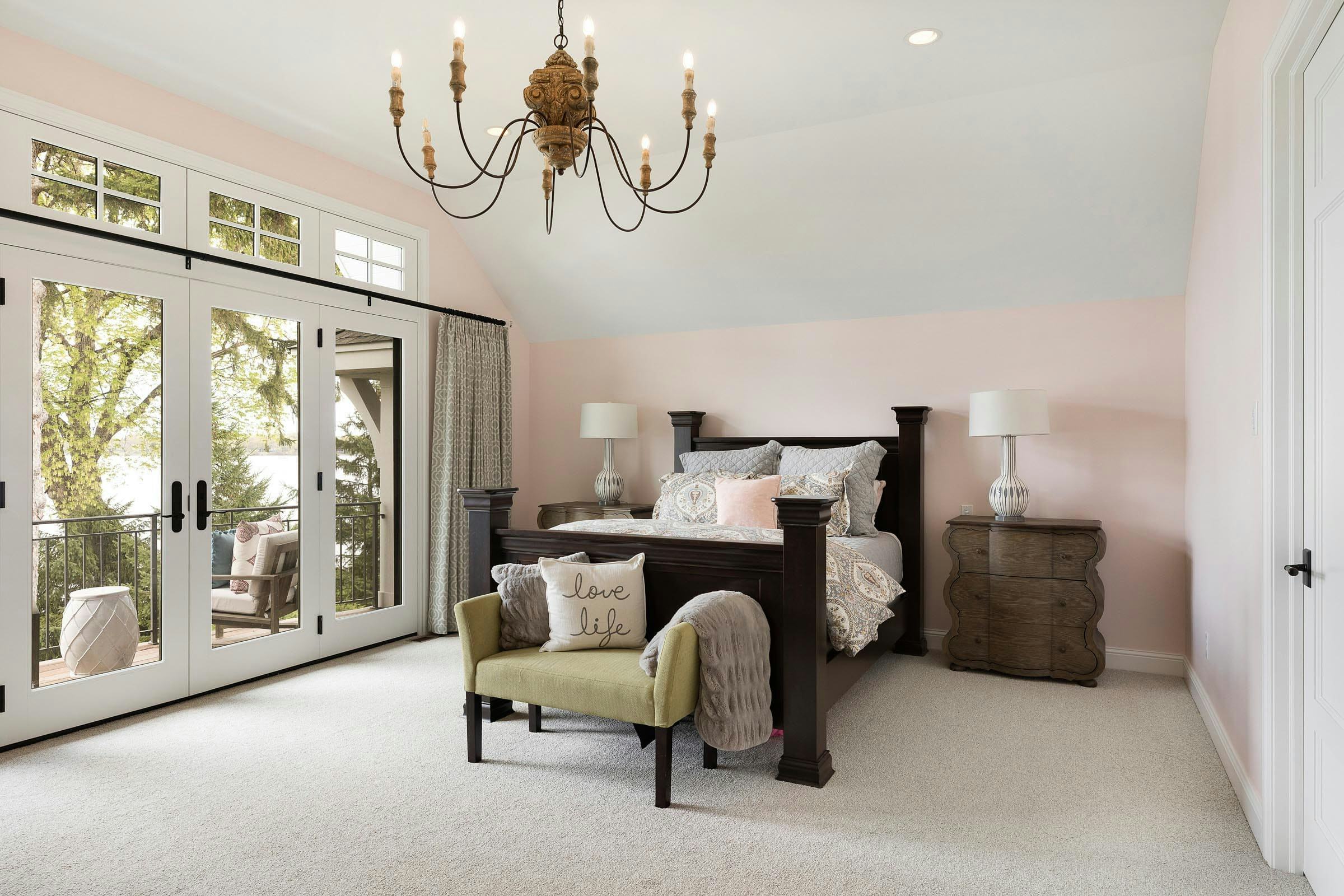 pink owner's suite bedroom overlooking the lake, balcony, chandelier 