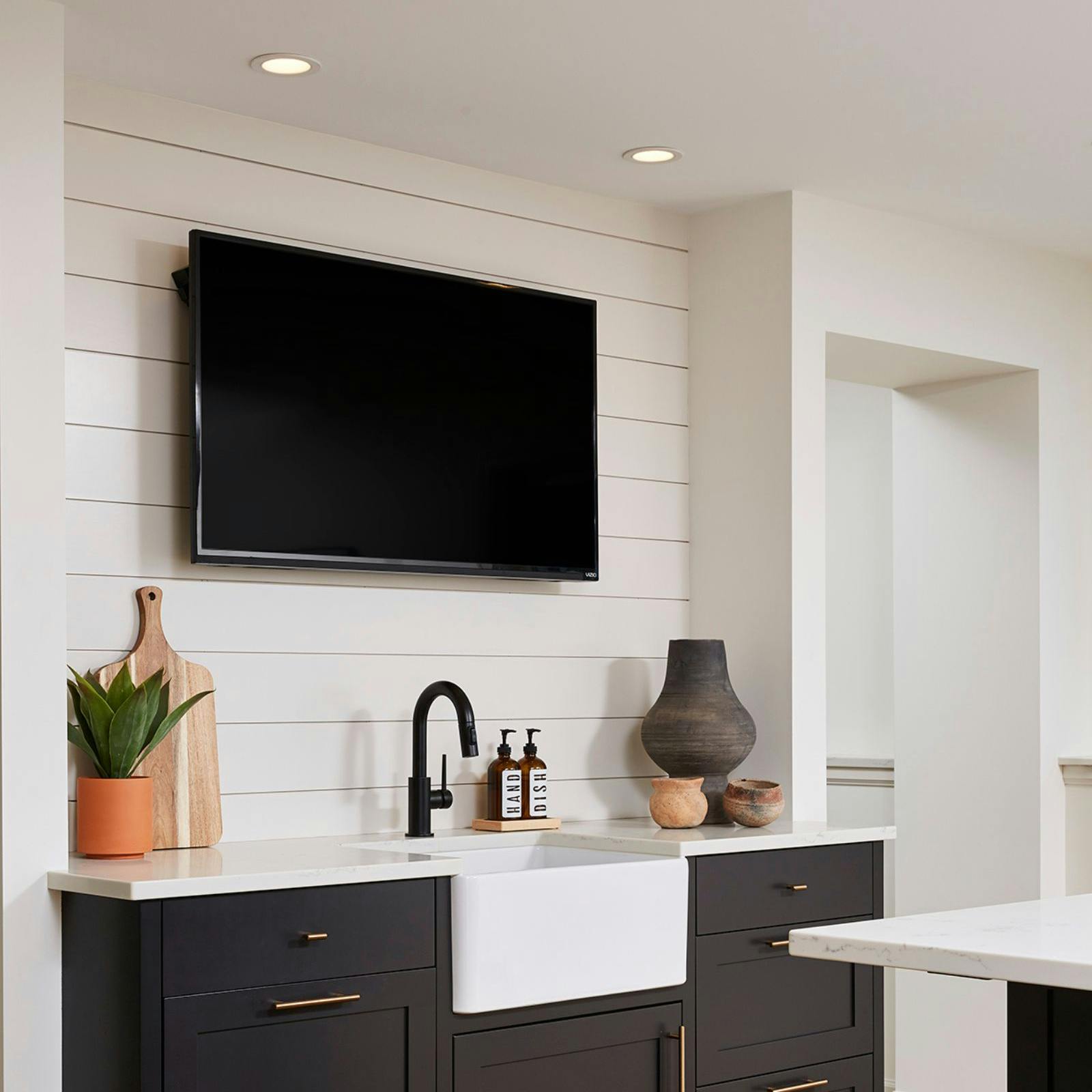 kitchen wall with sink and TV