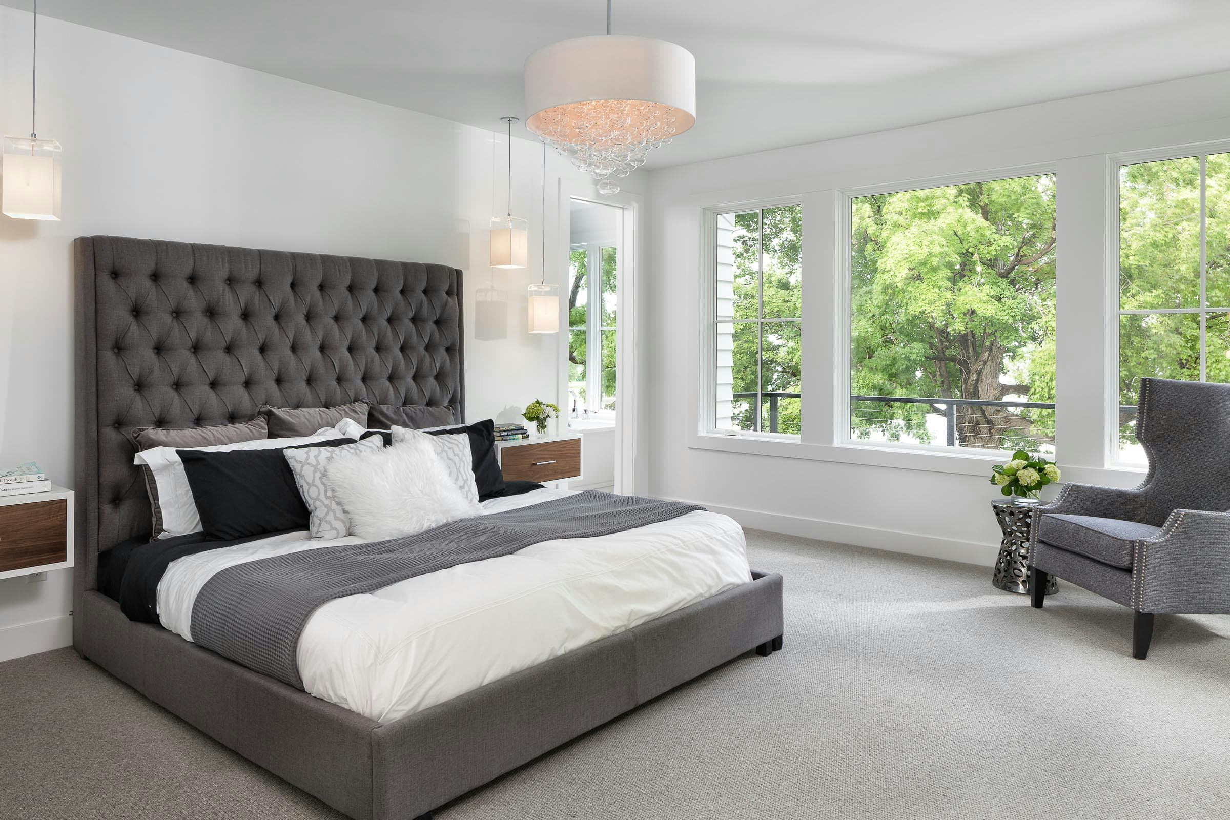 white and grey bedroom with large windows