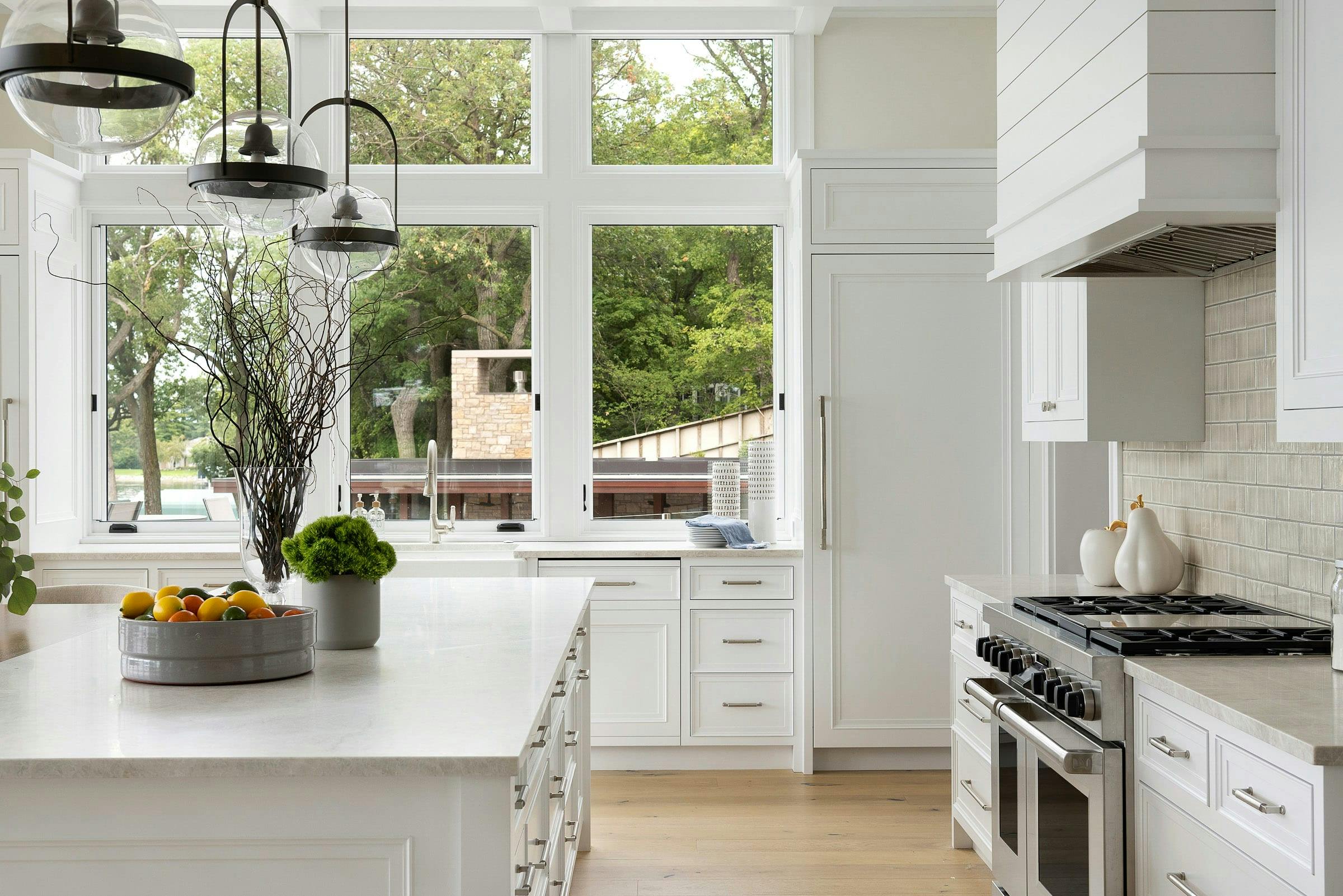 white kitchen, sink with three windows