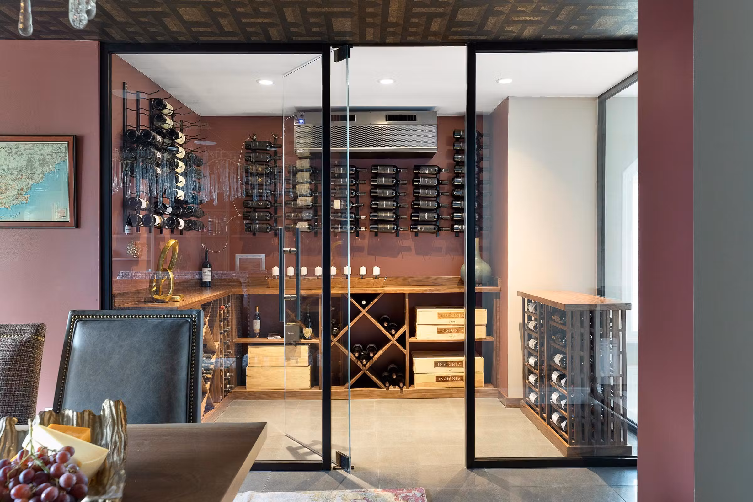 wine cellar with cooling system maintains the ideal climate for the owner's expansive collection of wine