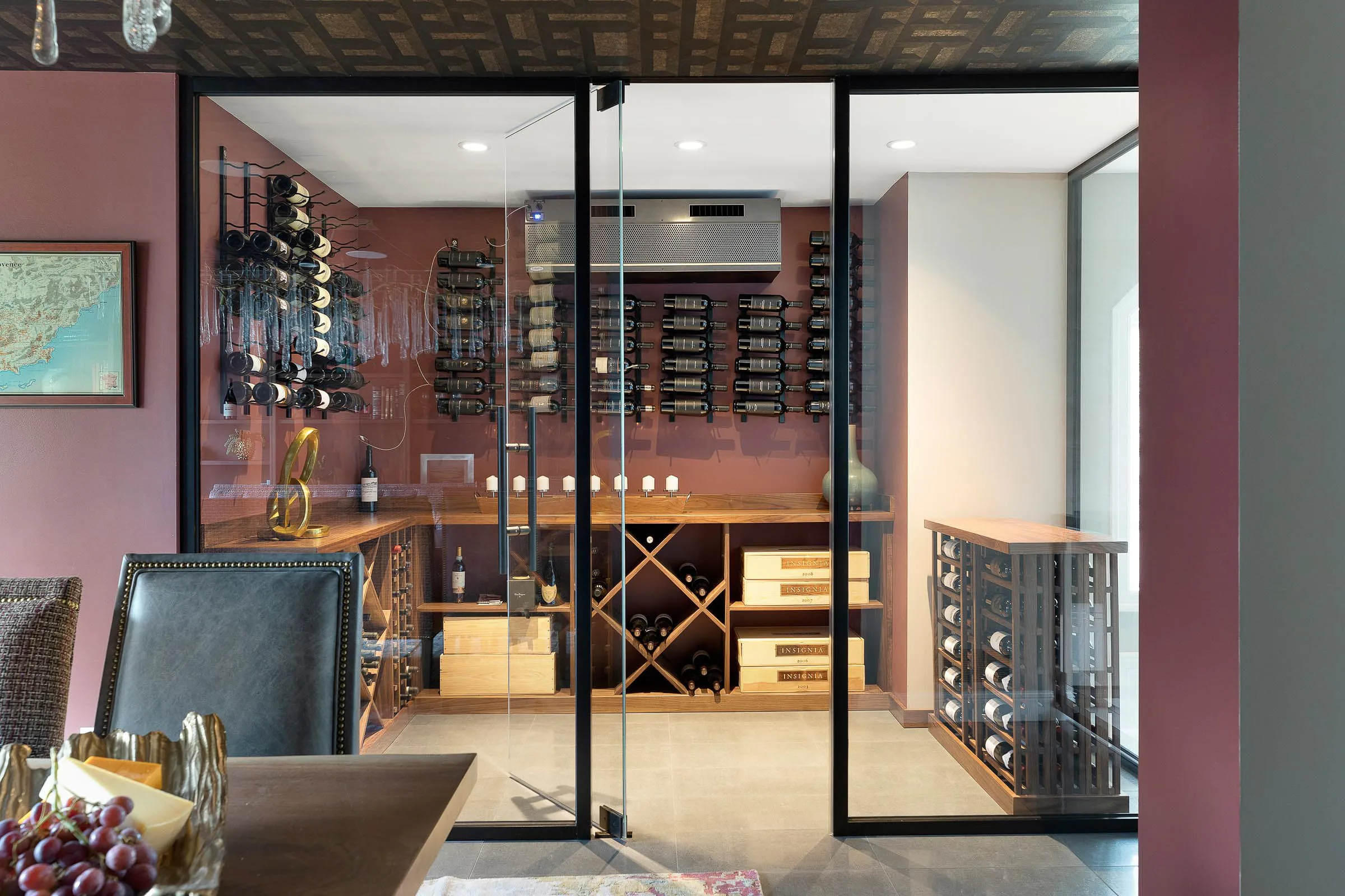 wine cellar with cooling system maintains the ideal climate for the owner's expansive collection of wine
