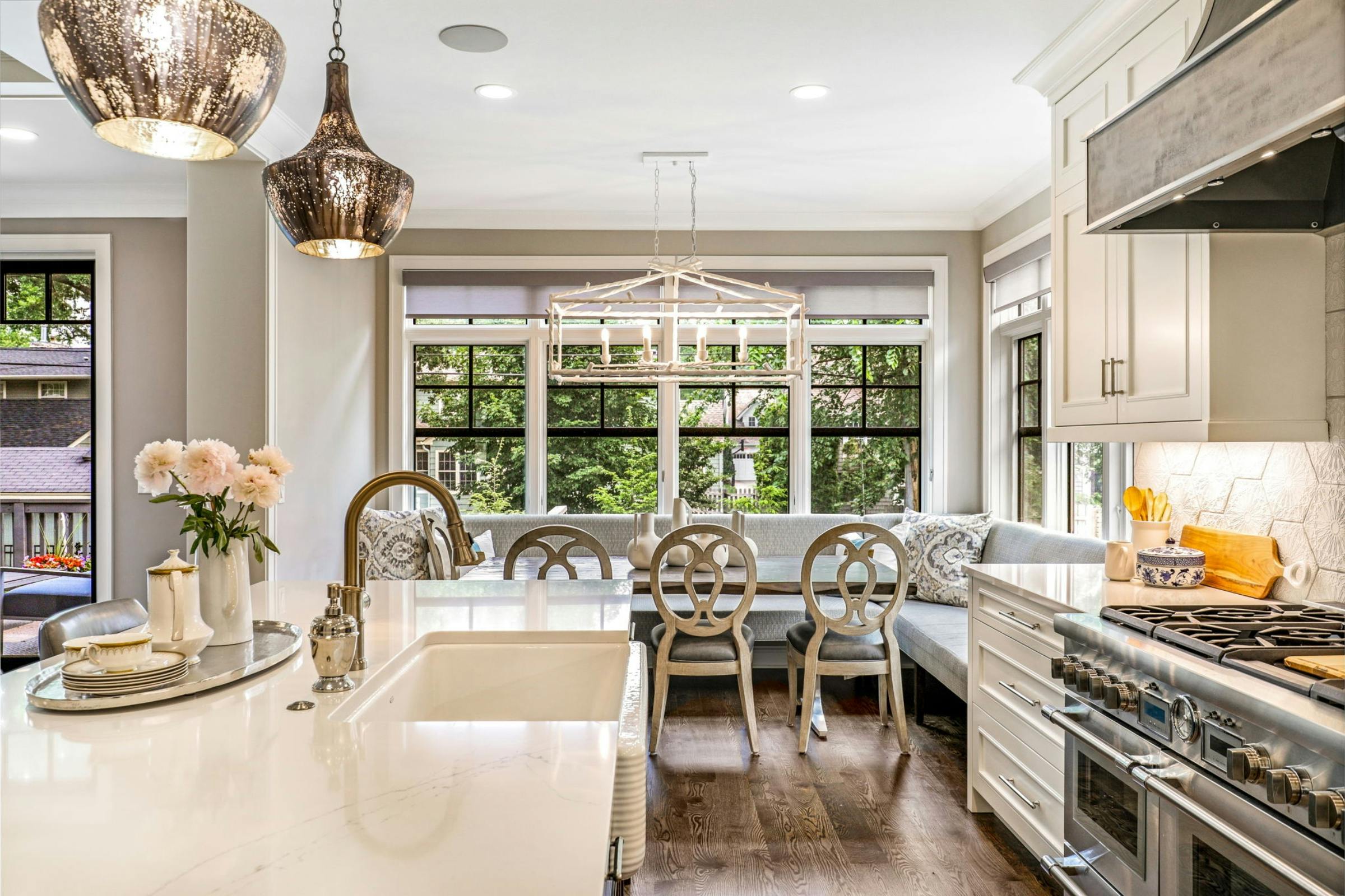 kitchen with sink and countertops, cooktop and range