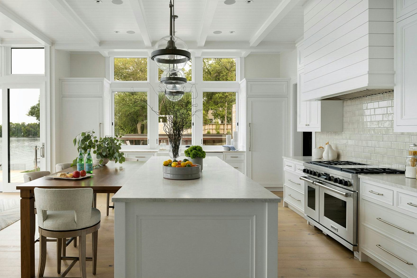 white kitchen, tall ceiling and windows