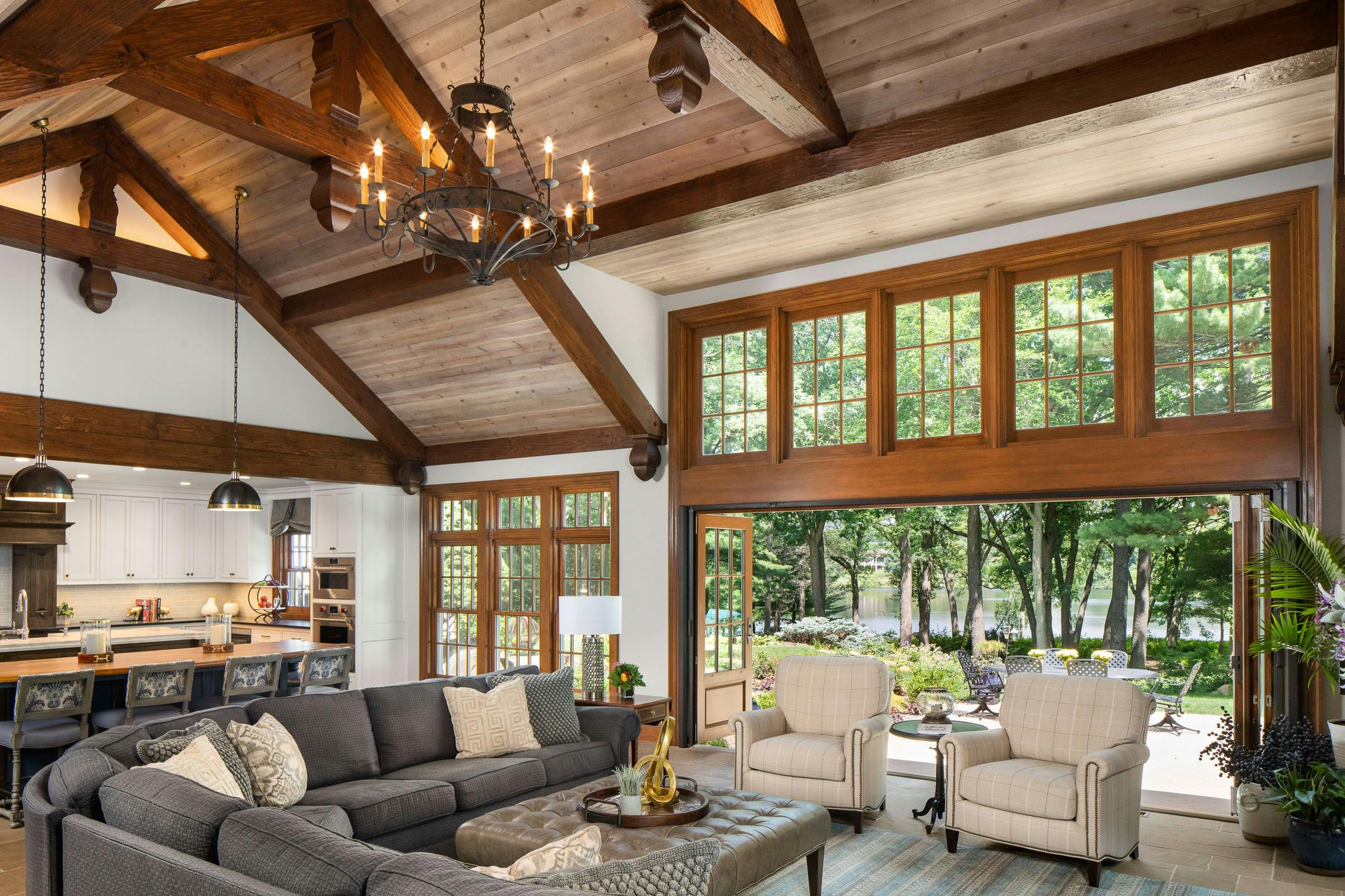 living room, kitchen leads to the outdoors, tall ceilings, chandelier