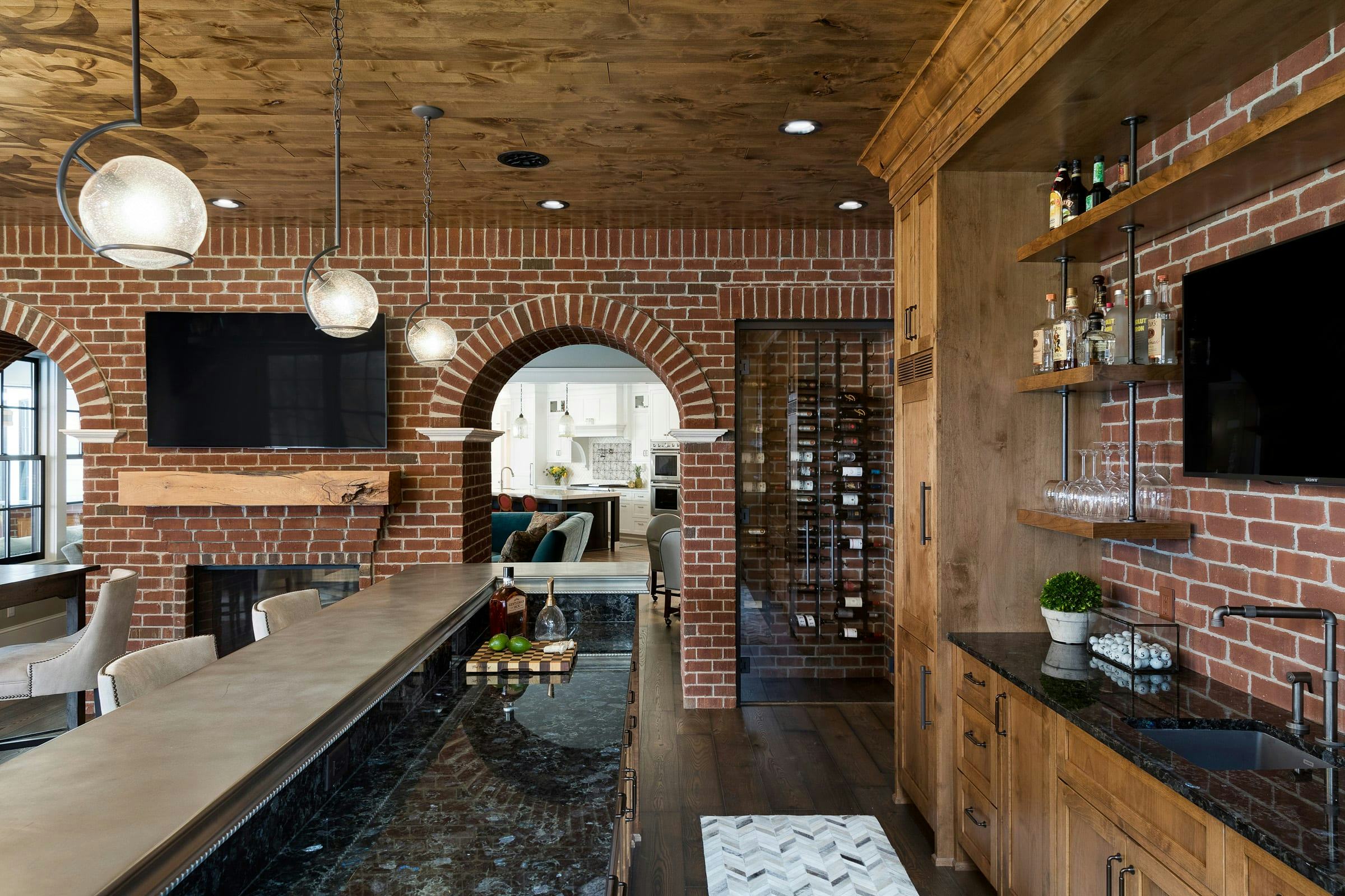 brick and wood bar, light fixtures above bar top