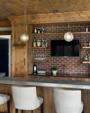 TV above bar, white bar stools