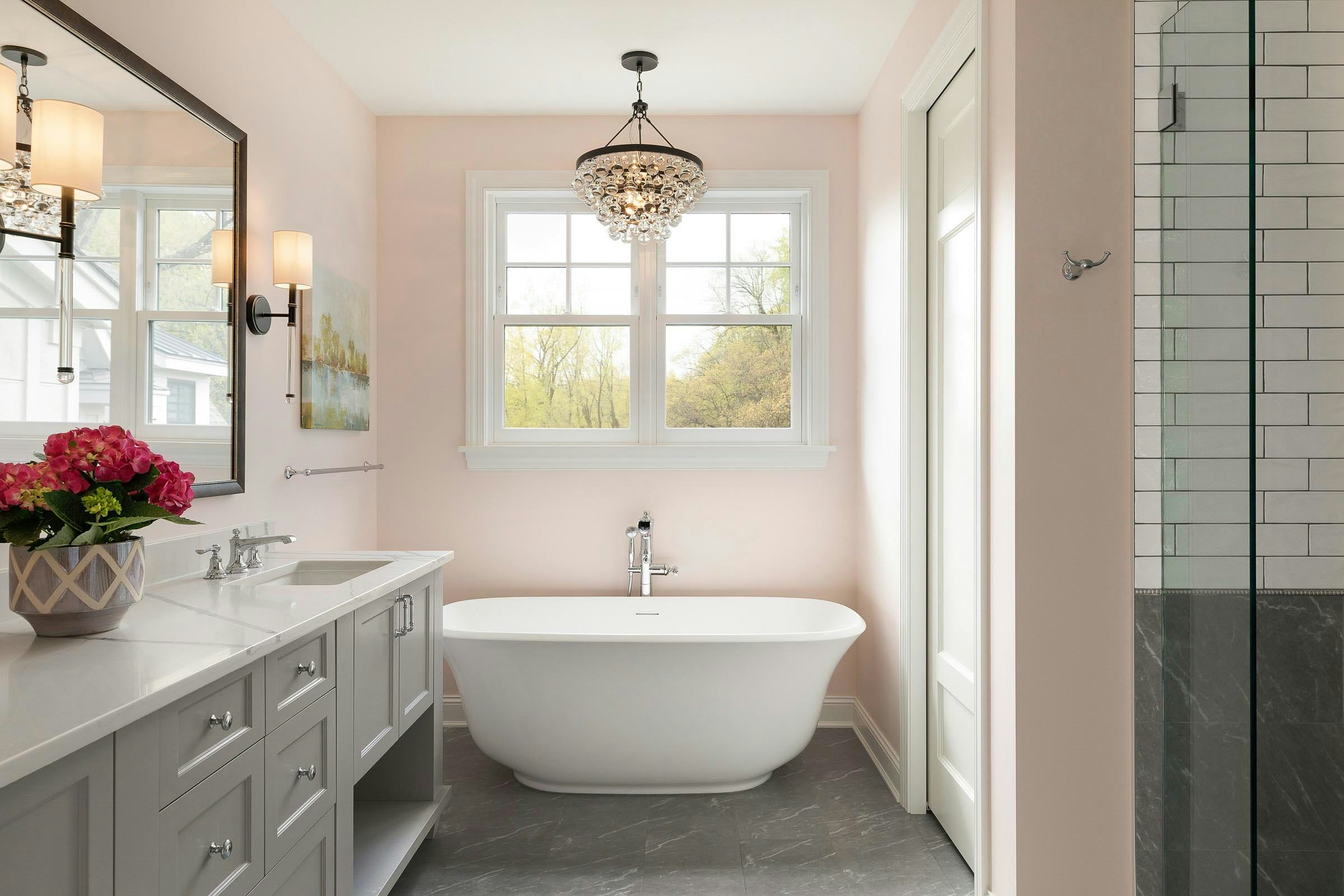 pink owner's suite bathroom, free standing tub, white and grey shower