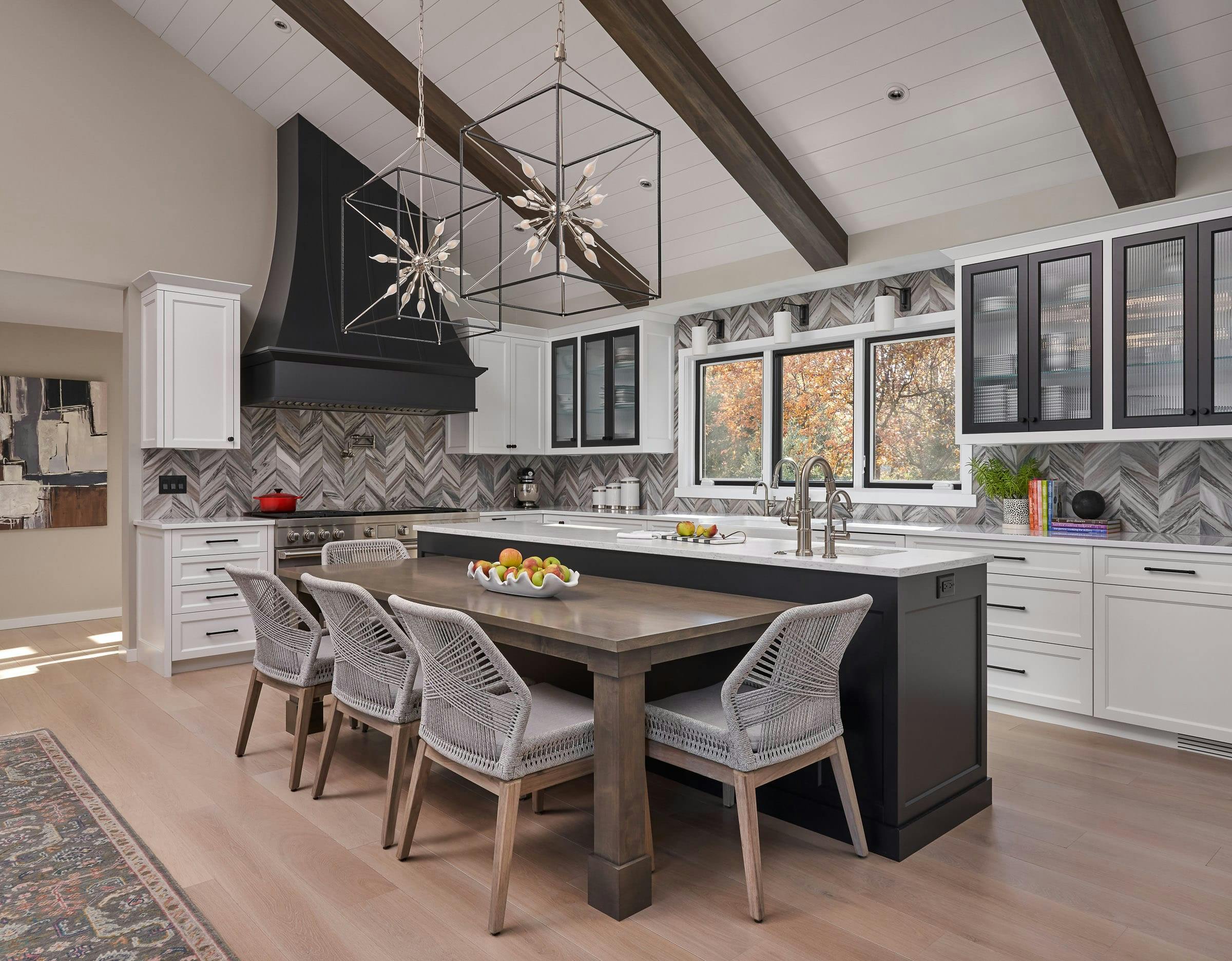 black and white kitchen with brown table