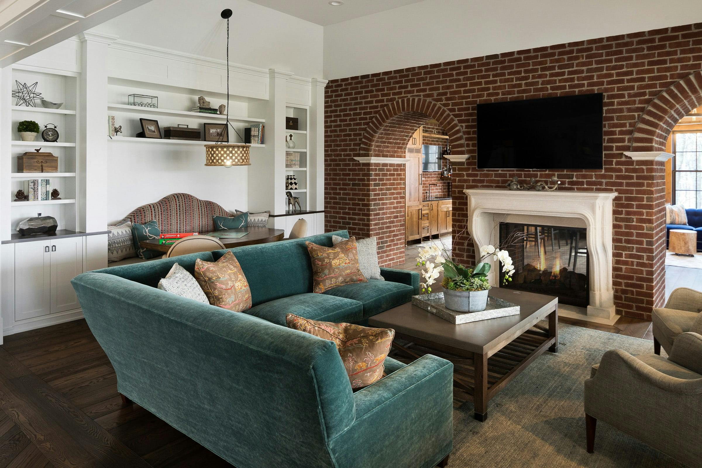 brick family room, TV, sofas