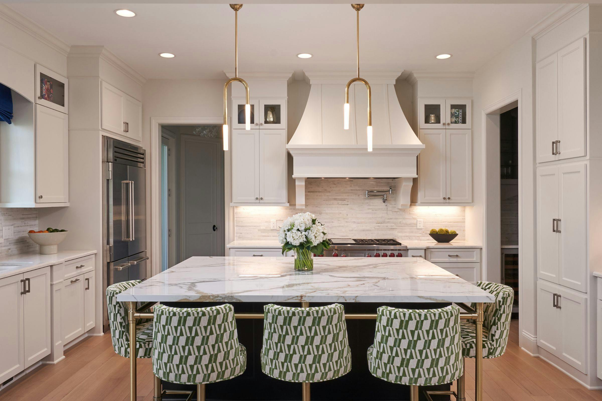 white kitchen with green stools