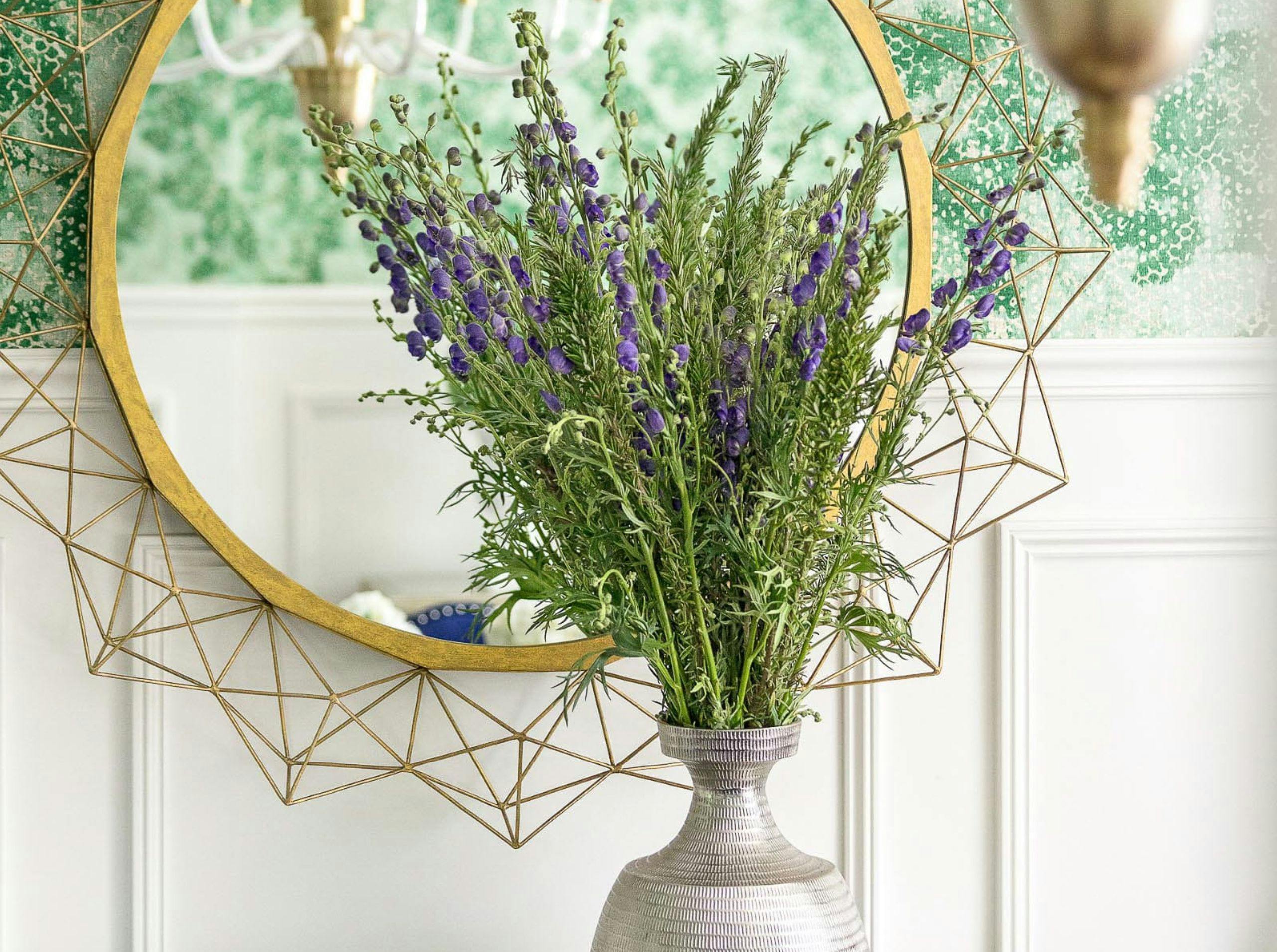 gold mirror, vase with flowers