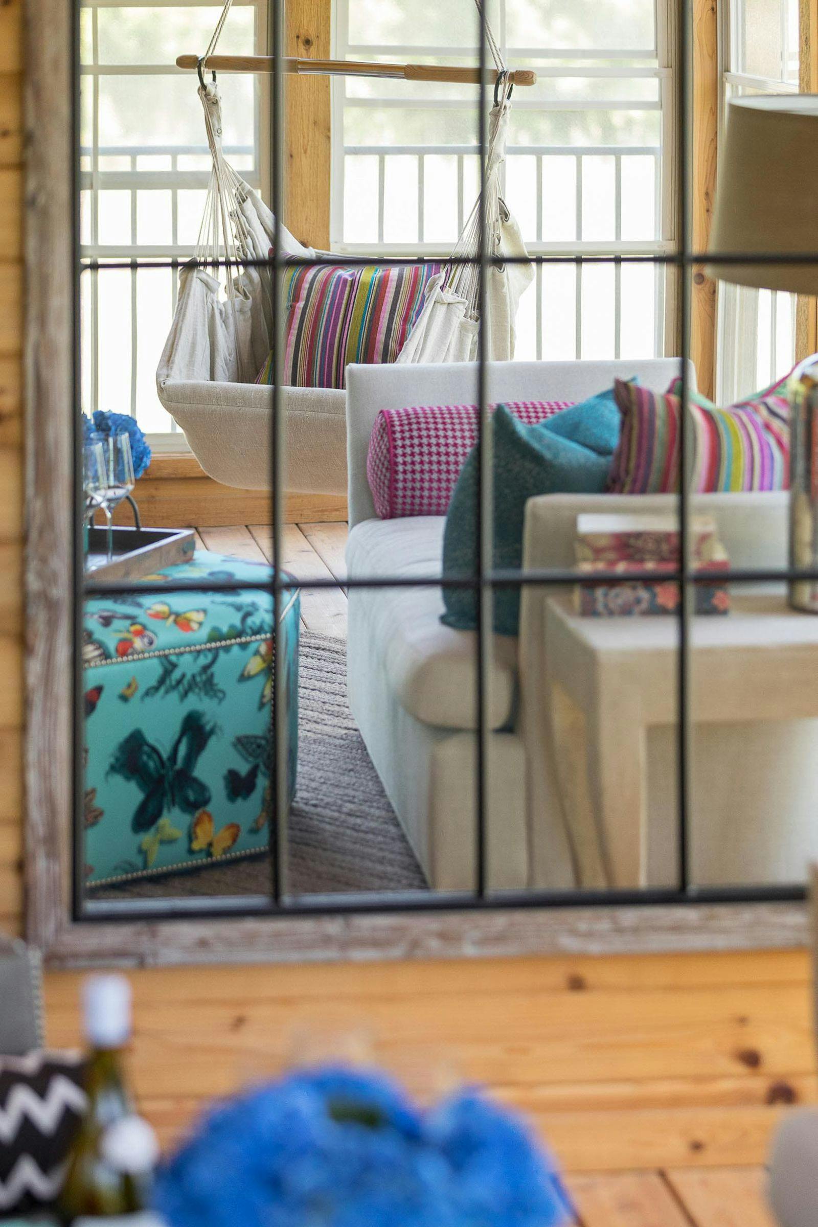 ottoman and sofa in reflection of a mirror