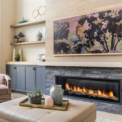 living room fire place with a colorful tv frame above