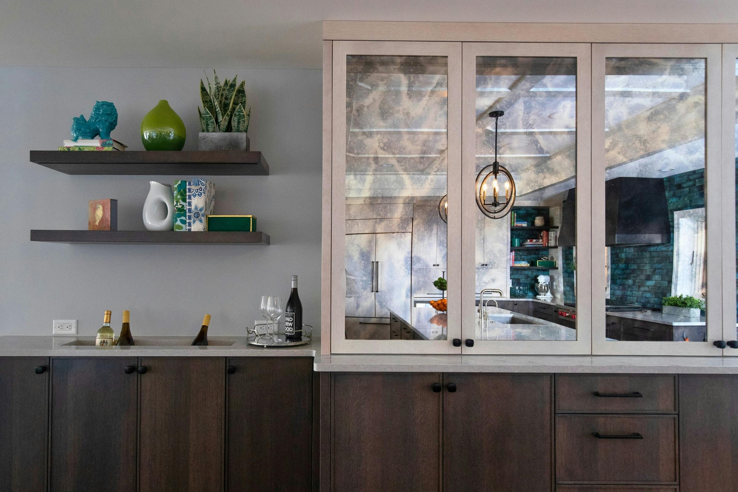 white upper cabinet with mirror and dark wood lower cabinets