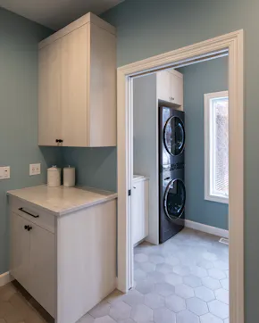 black appliance stacked washing machine and dryer