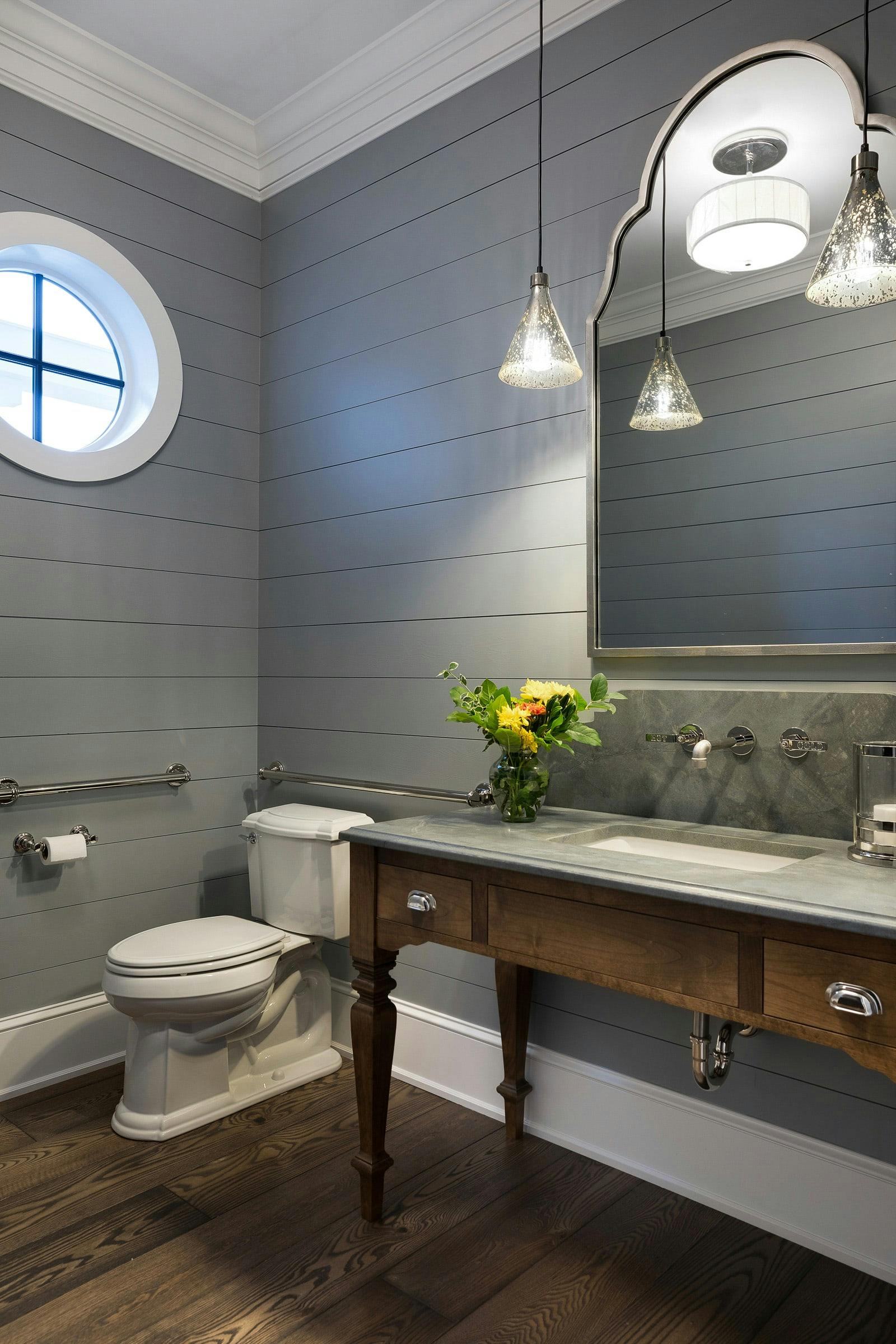 gray shiplap bathroom with vanity and toilet