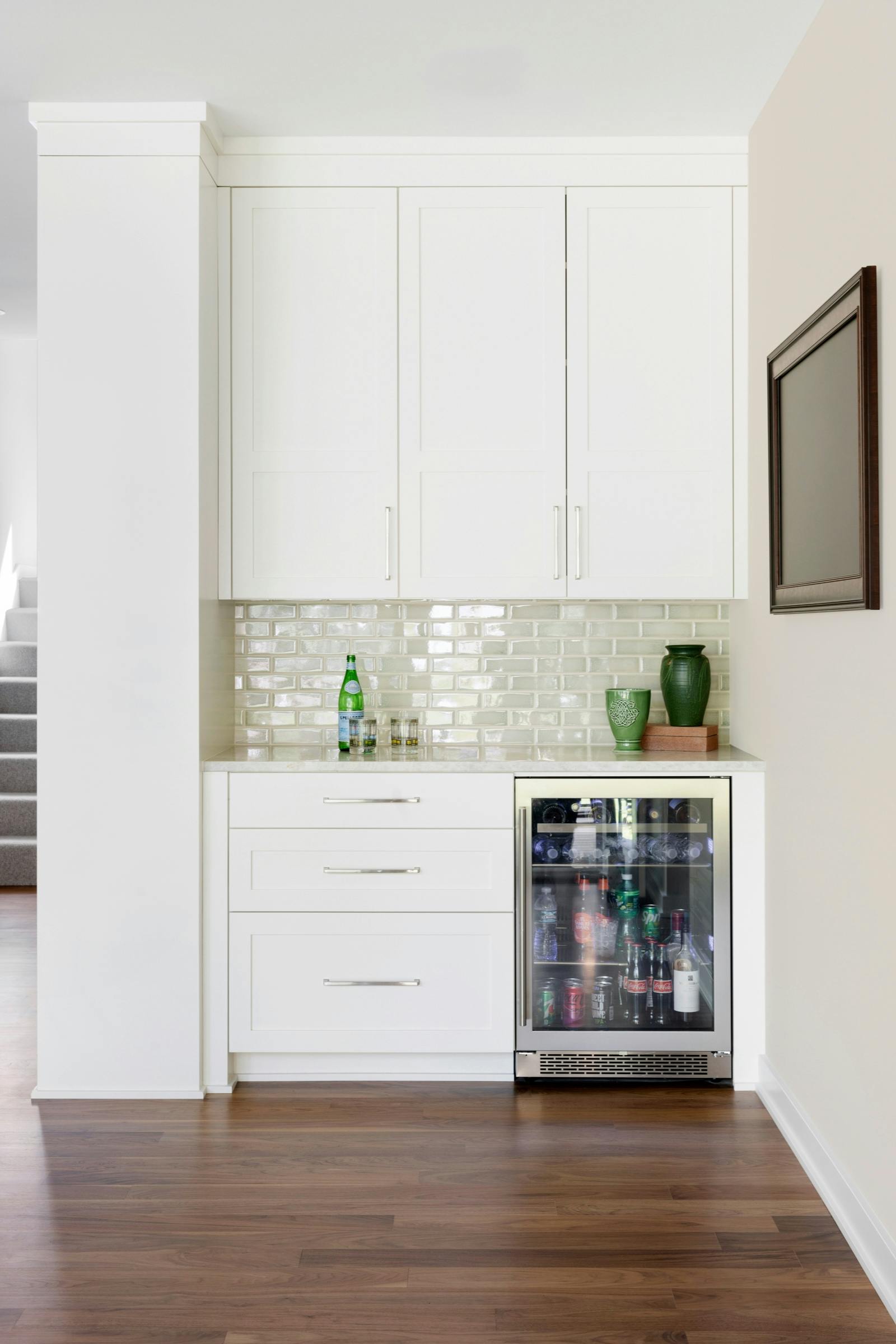 white cabinets and beverage cooler