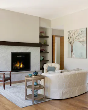 light and neutral living room with fireplace