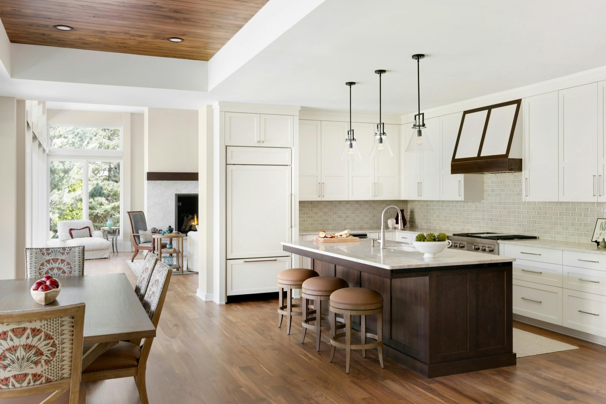 white and wood kitchen leads into the living room