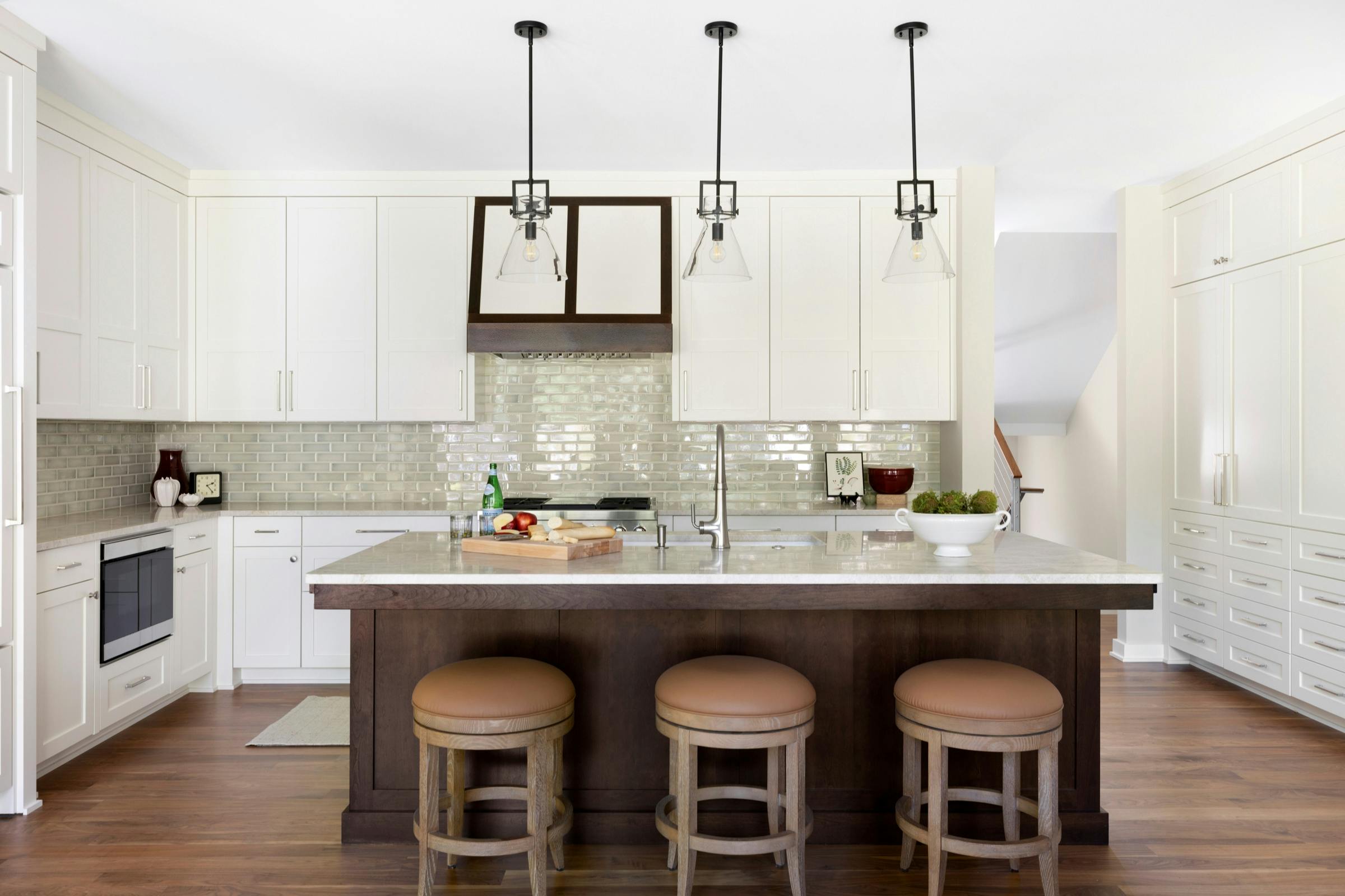 kitchen with wood island with white countertops